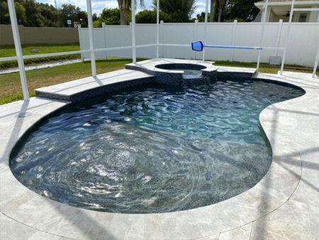 Modern pool renovation and resurfacing by JJB Pools & Spas in Tampa Bay.
